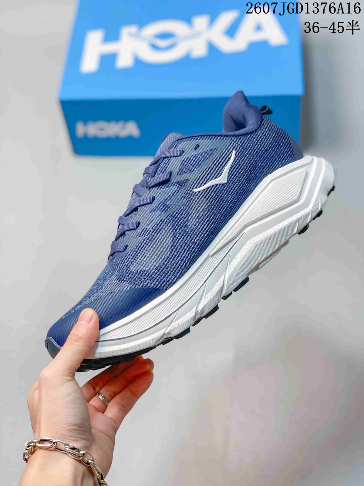Side profile of the blue HOKA Challenger 8 shoe showing the mesh-textured upper, white midsole, and outsole.