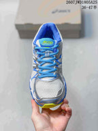 Front view of the sneaker showing the mesh-look toe box, blue laces, and contrasting trim.