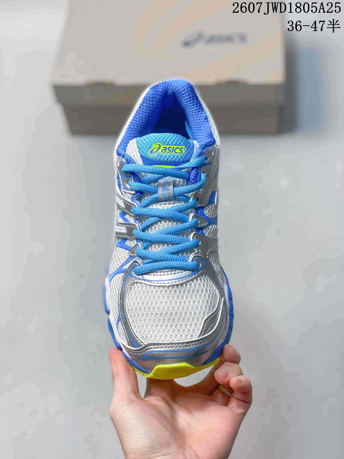 Front view of the sneaker showing the mesh-look toe box, blue laces, and contrasting trim.