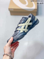 Side profile of the ASICS Hypersync sneaker showing the layered cream side detailing and low-top shape.