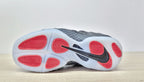 Outsole of the Nike Air Foamposite Pro Fleece sneaker with red traction sections