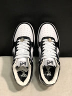 Top-down view showing white perforated toe panels, white laces, tongue branding and padded collars.