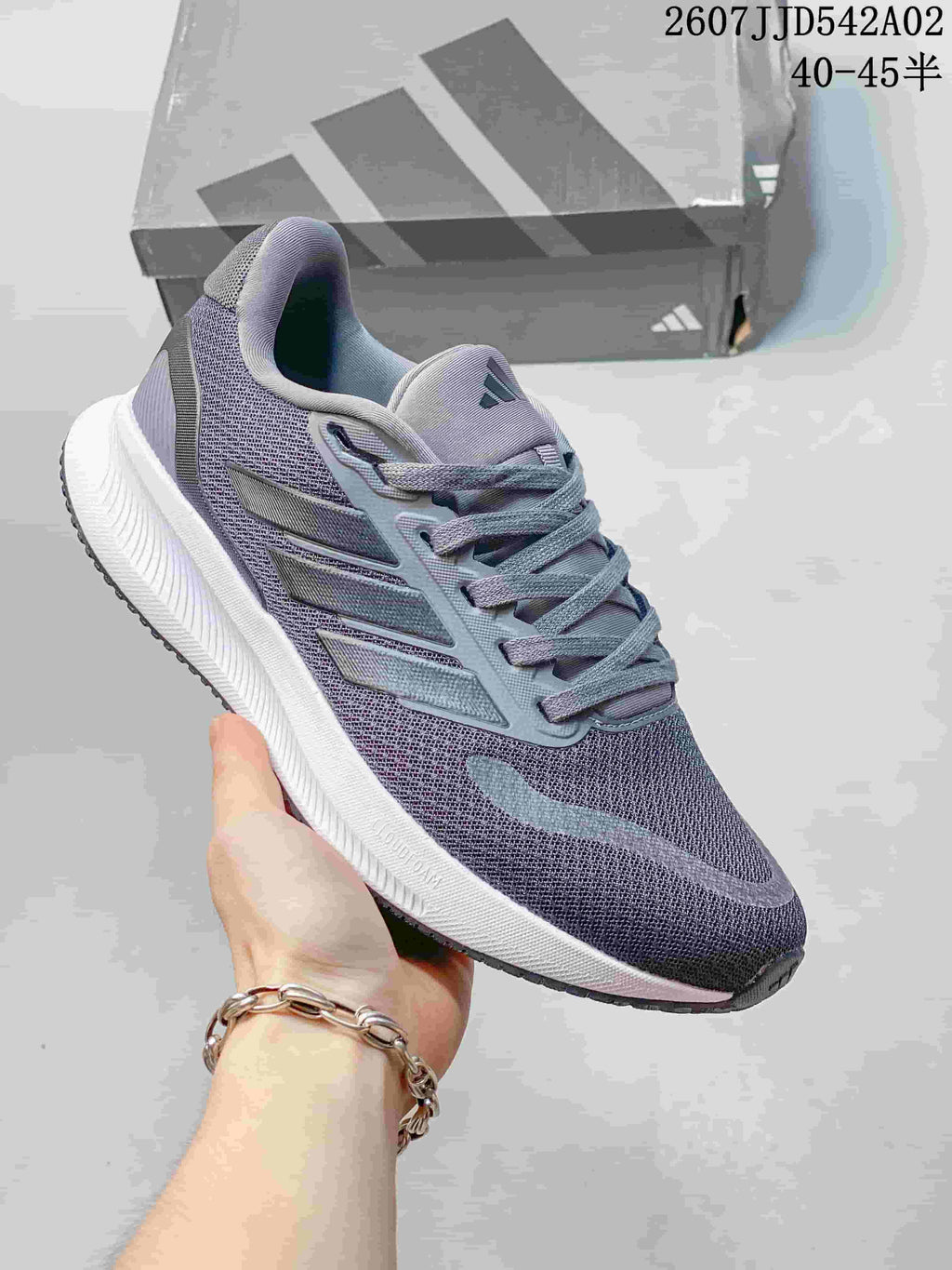 Gray adidas Runfalcon 5 shoe with a white sole and subdued side stripes.