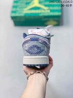 Rear view showing the embroidered winged basketball emblem, blue detailing and white midsole.