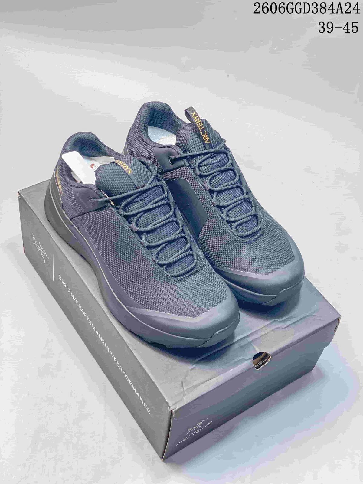 Pair of dark gray Arc'teryx Norvan Kopec GTX low-top shoes on a shoe box