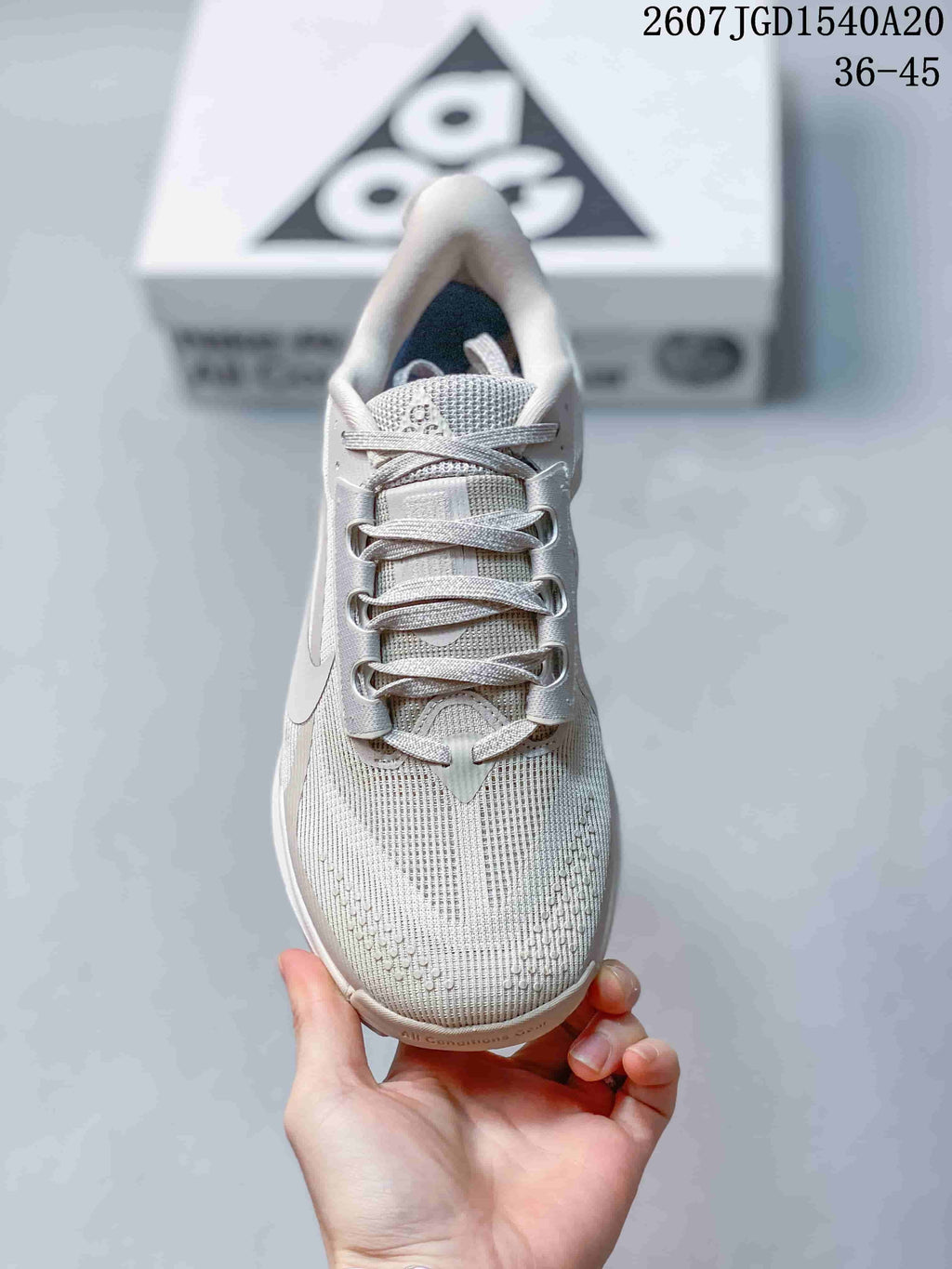 Top view showing the textile-look upper, tongue, eyelets, and flat laces.