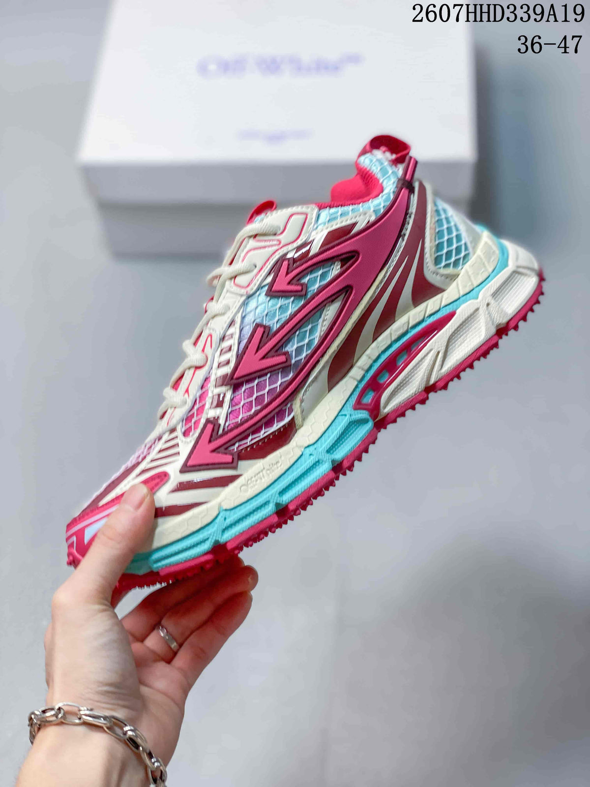 Side view highlighting the mesh panels, layered overlays, lace-up fastening, and textured outsole.