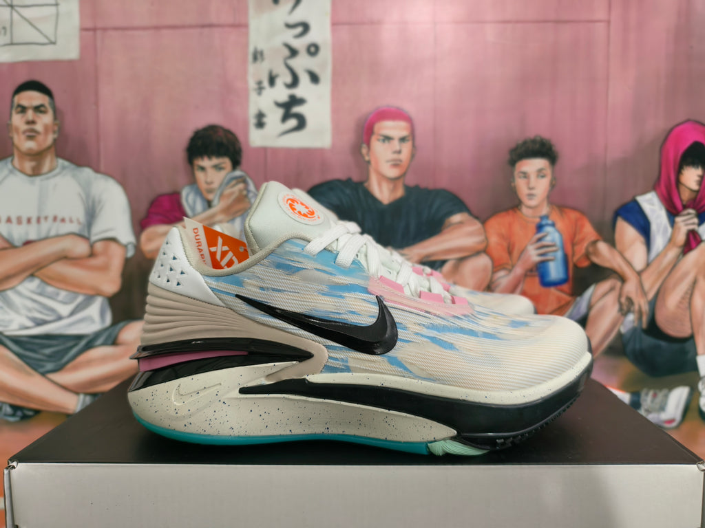 Side view showing a black swoosh, gray-blue upper, and speckled midsole.