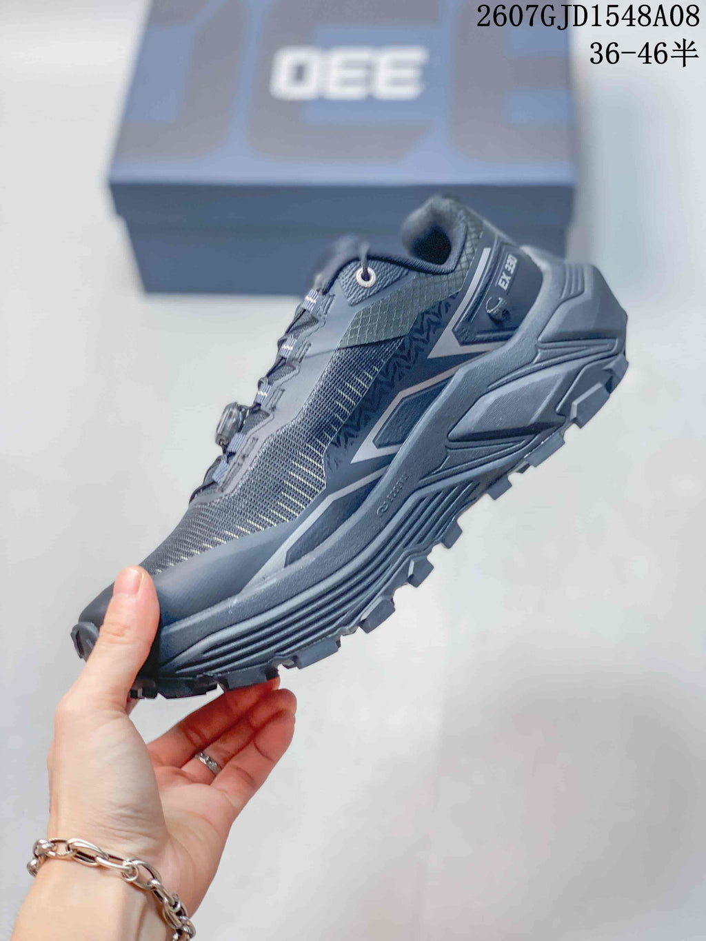 Side profile of the Kailas Fuga Ex 330 shoe showing the textile upper, layered midsole, and rugged outsole.