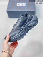 Side profile of the Kailas Fuga Ex 330 shoe showing the textile upper, layered midsole, and rugged outsole.