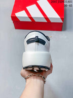 Rear view showing the heel, pull tab and thick midsole.