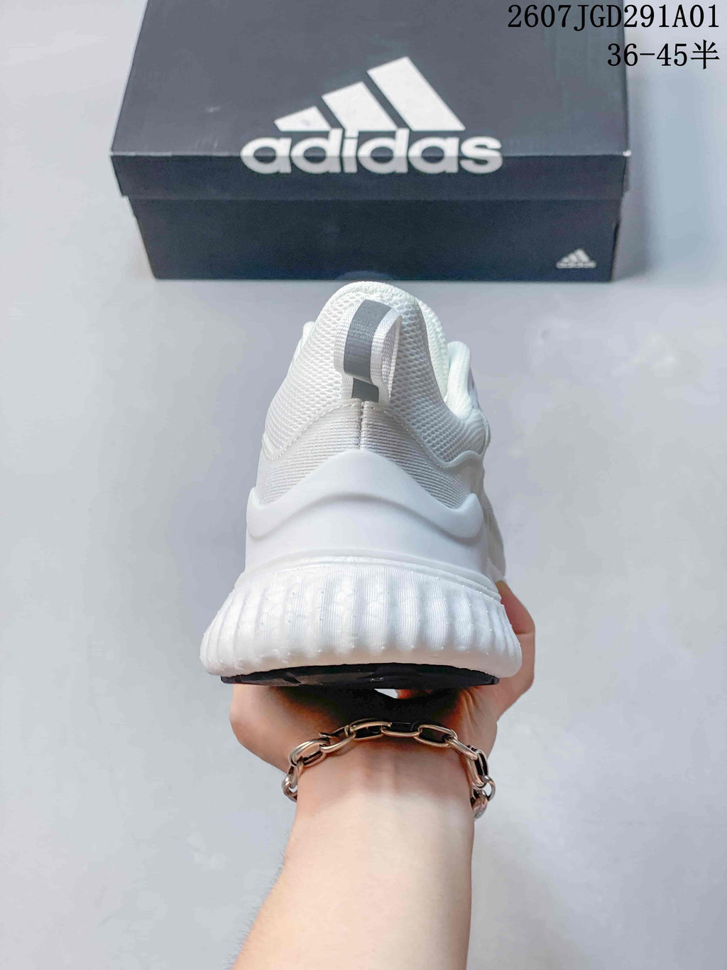 Rear view showing the heel and textured white sole of the sneaker