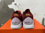 Rear view of burgundy Nike Kobe shoes with USC lettering and signature heel panels