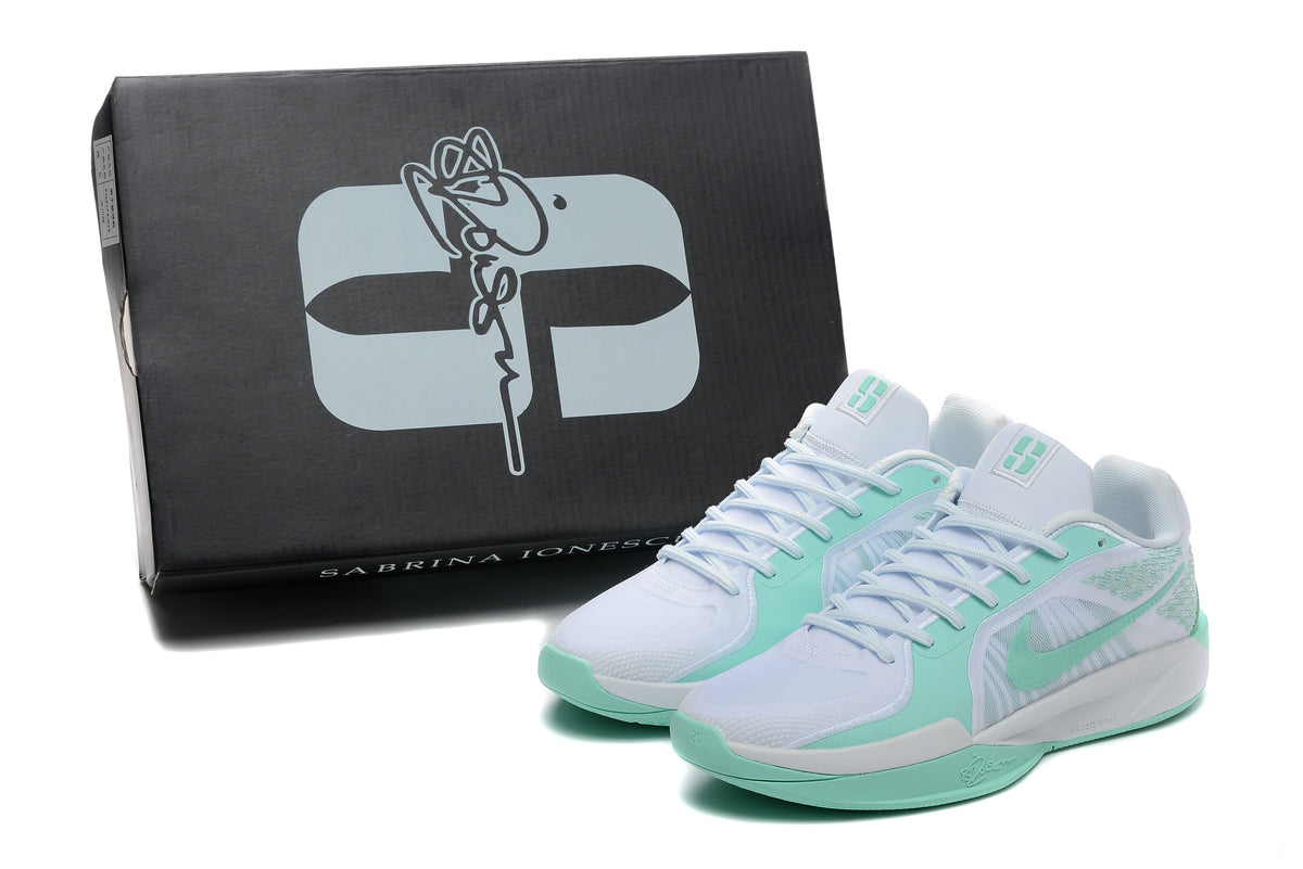 White and mint-green Nike Sabrina basketball shoes beside a Sabrina Ionescu-branded box