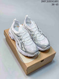 Pair of white and silver ASICS GT-2160 Breeze sneakers shown from above on a shoe box.
