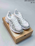 Pair of white and silver ASICS GT-2160 Breeze sneakers shown from above on a shoe box.