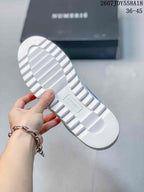 Close-up of the white textured outsole with a central NUMERIS mark and raised tread sections.