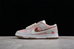 Opposite side profile showing the low-top construction, layered Swoosh, pink panels, and cherry embroidery.
