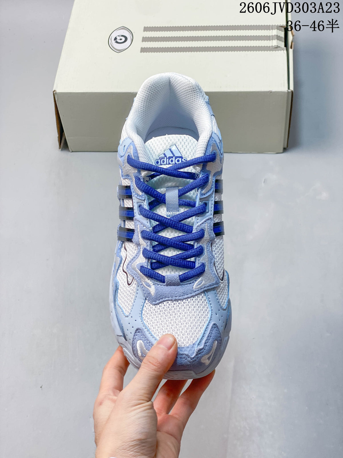 Top view showing the mesh-style tongue, blue laces, and patterned upper.