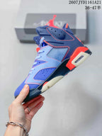 Side profile of a blue high-top sneaker with red stitching, perforated panels, a visible air cushioning window, and a sculpted sole.