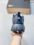 Rear view of a dark gray Altamesa 500 sneaker showing the padded heel, pull tab, and textured heel section.