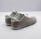 Rear three-quarter view showing the gray heel panels and white Alo-branded heel details.