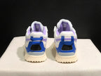 Rear view of the sneaker pair showing blue heel sections, black mesh panels and purple padded collars; both tongues show size 40 labels.