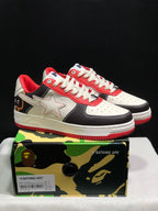 Pair of BAPE STA low-top sneakers in white, black, and red displayed above a branded camouflage shoe box; the box label shows EUR 41 and CM 26 for the photographed sample.