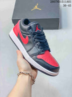 Angled view of a black and red low-top Jordan sneaker with white midsole