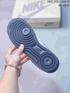 Close view of the dark rubber outsole, showing its circular traction pattern and textured perimeter.