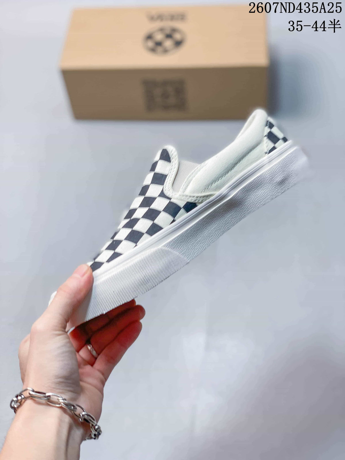 Side view showing the low-top slip-on profile, checkerboard upper, and white rubber sole.