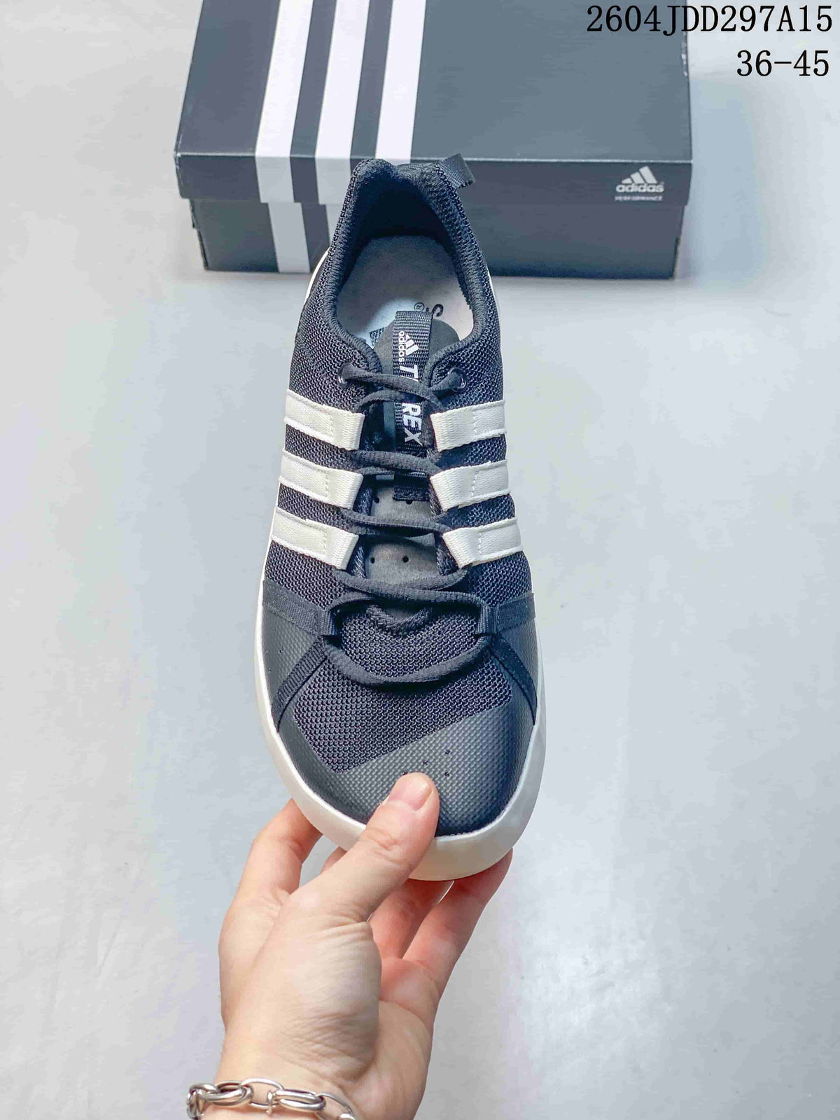 Top view of the shoe showing the mesh toe box, perforated detailing, lace closure, and three white stripes.