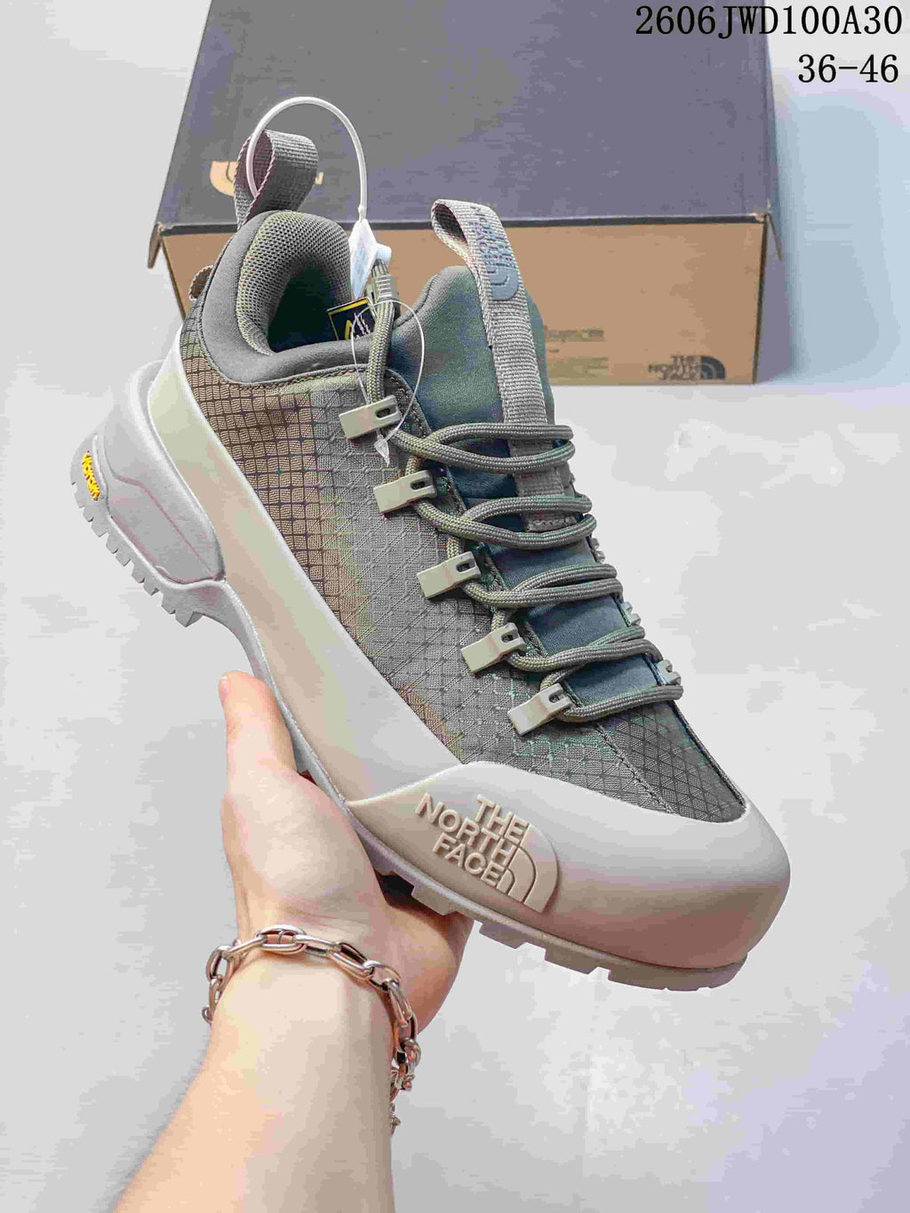Gray and white low-top The North Face Glenclyffe shoe with patterned upper and lace-up closure.