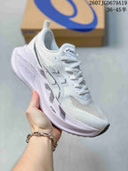 White ASICS SUPERBLAST 2 low-top running shoe with black detailing and a white sole, shown from a front three-quarter angle.