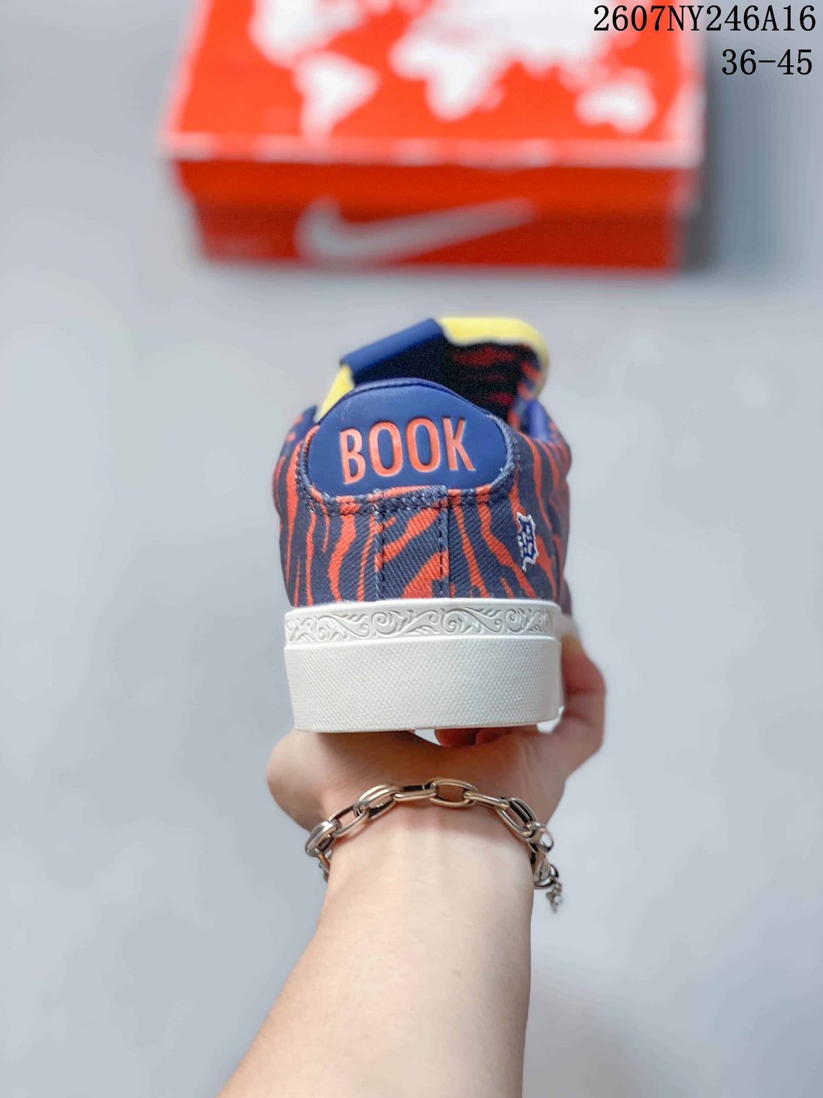Rear view showing the “BOOK” heel lettering and decorative white midsole trim.