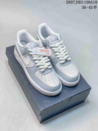 Gray and white Nike Air Force 1 ’07 low-top sneakers displayed on a shoebox, with the source size note visible above.