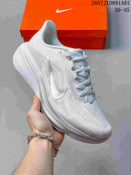 Side view of a white Nike Air Zoom Pegasus 42 running shoe with a metallic-tone Swoosh.