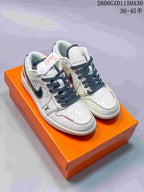 Pair of cream and dark navy Air Jordan 1 low-top sneakers with patterned panels and woven laces