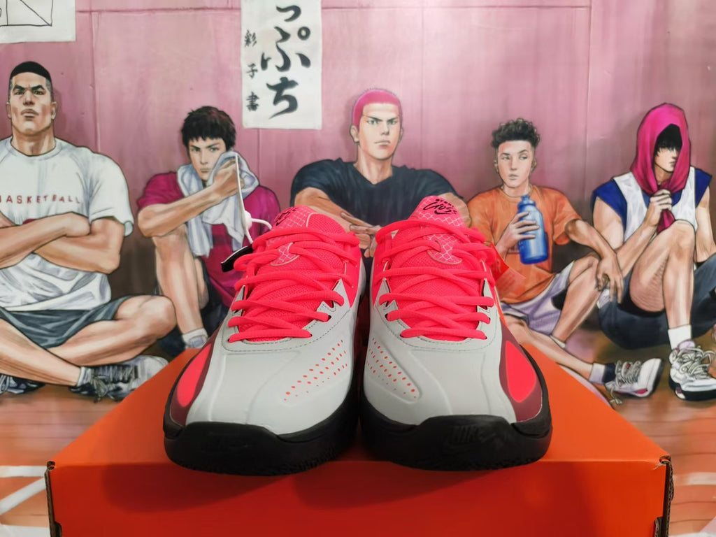 Front view of red, gray, and black Nike basketball shoes with red laces