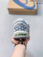 Rear view of the ASICS sneaker showing the textured heel panel and layered sole construction.