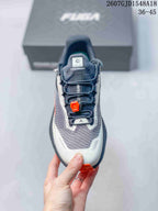Top view showing the textured gray toe area, dark laces, orange quick-lace hardware, and lace pocket.
