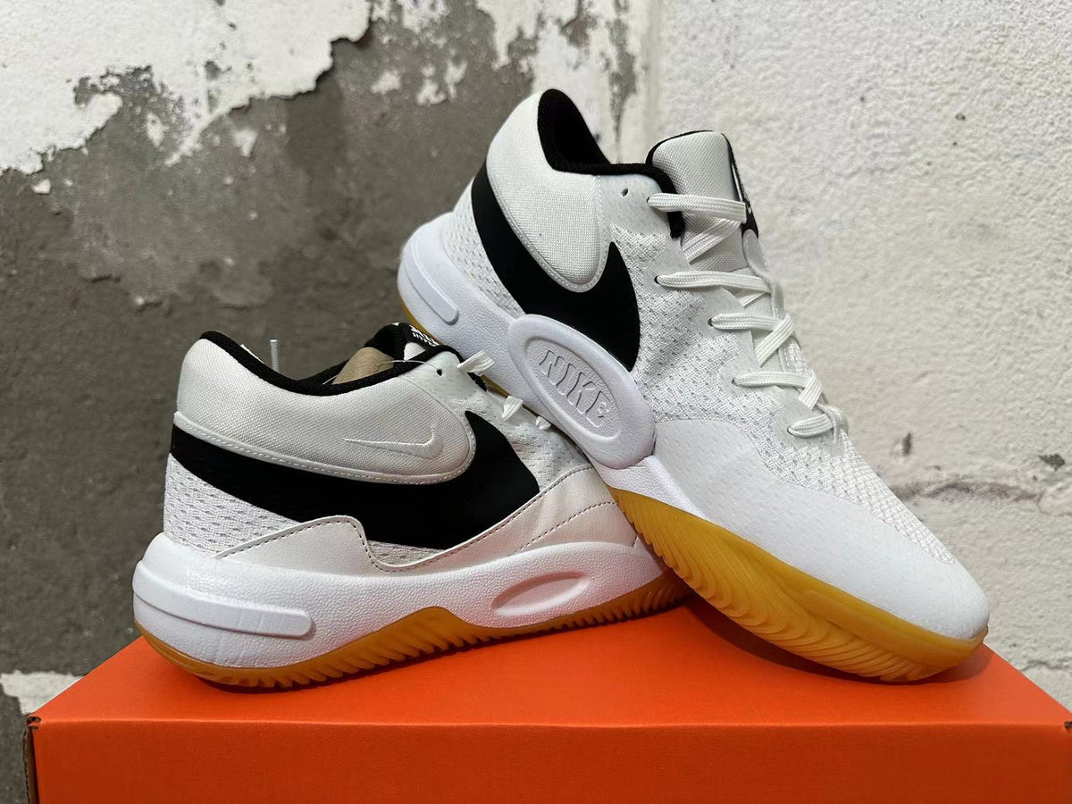 Pair of white and black Nike Hyperquick low-top shoes shown at an angle