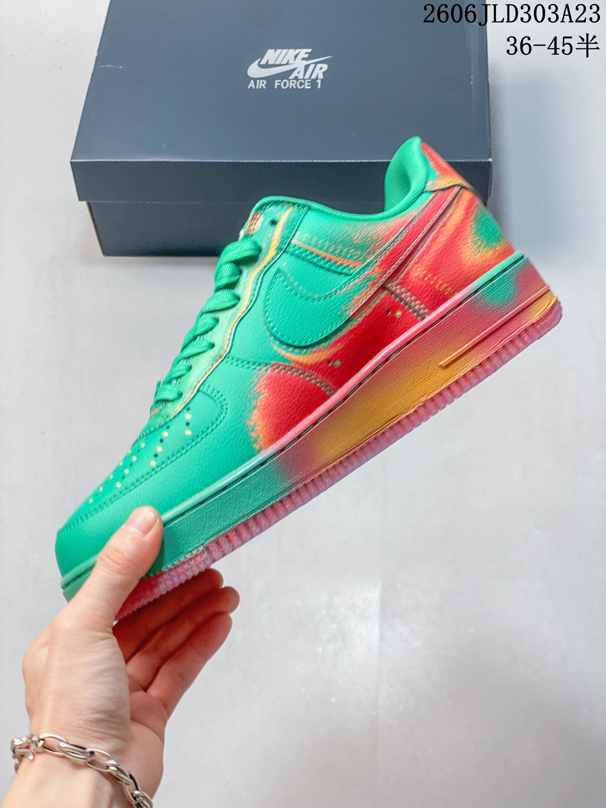 Side view showing the turquoise-green upper, Swoosh panel, and multicolor accents