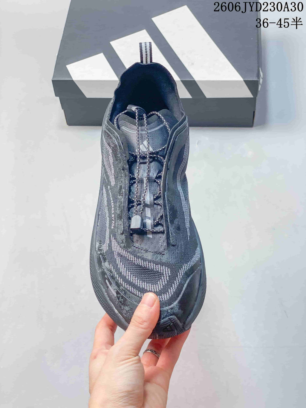 Top view of a gray trail running shoe with quick-lace style closure