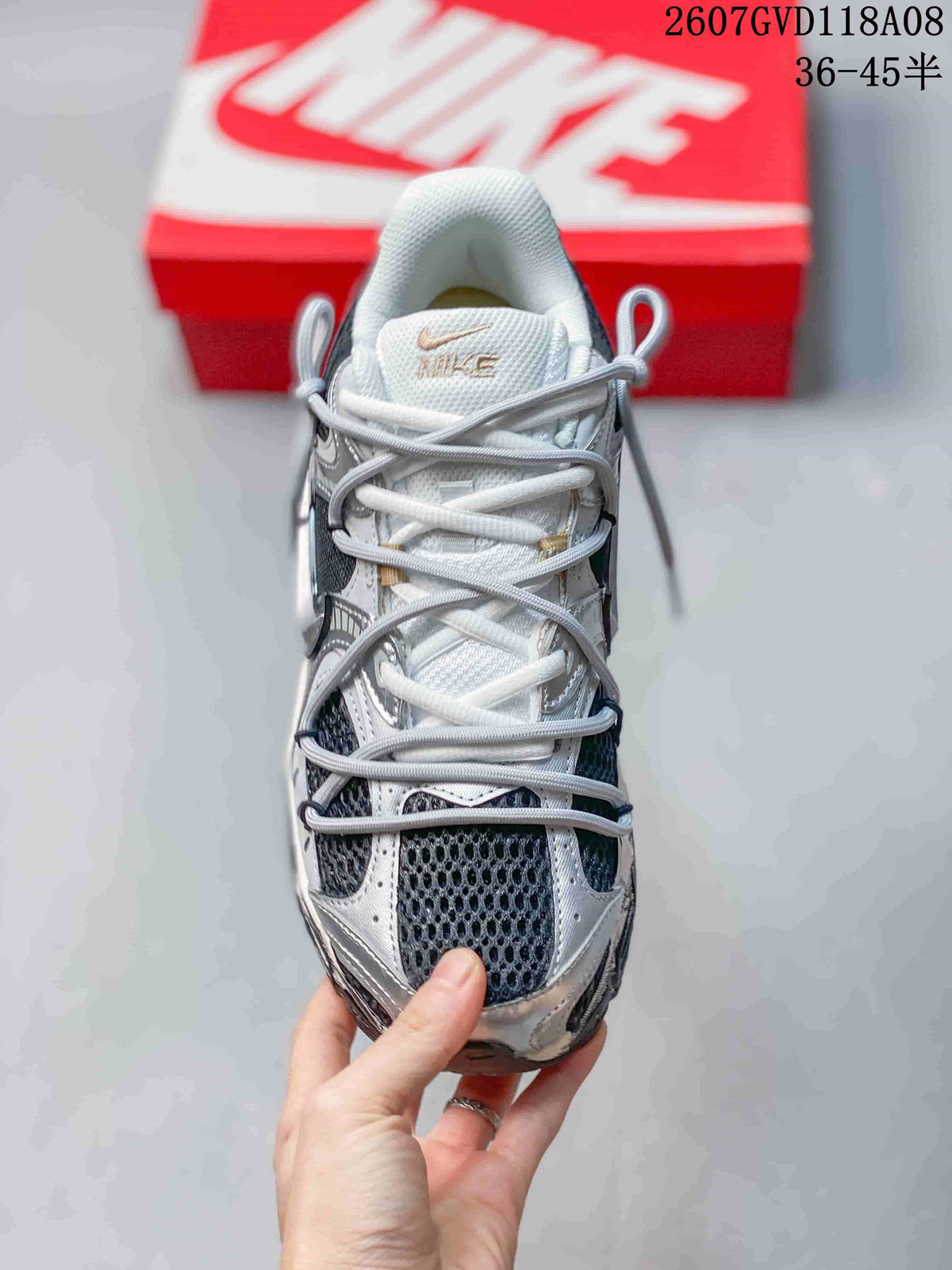 Top view of a Nike V5 RNR sneaker showing the mesh toe box, layered overlays and crisscrossing laces.