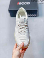 Top view of a white ECCO lace-up sneaker showing the perforated toe area and tongue logo.