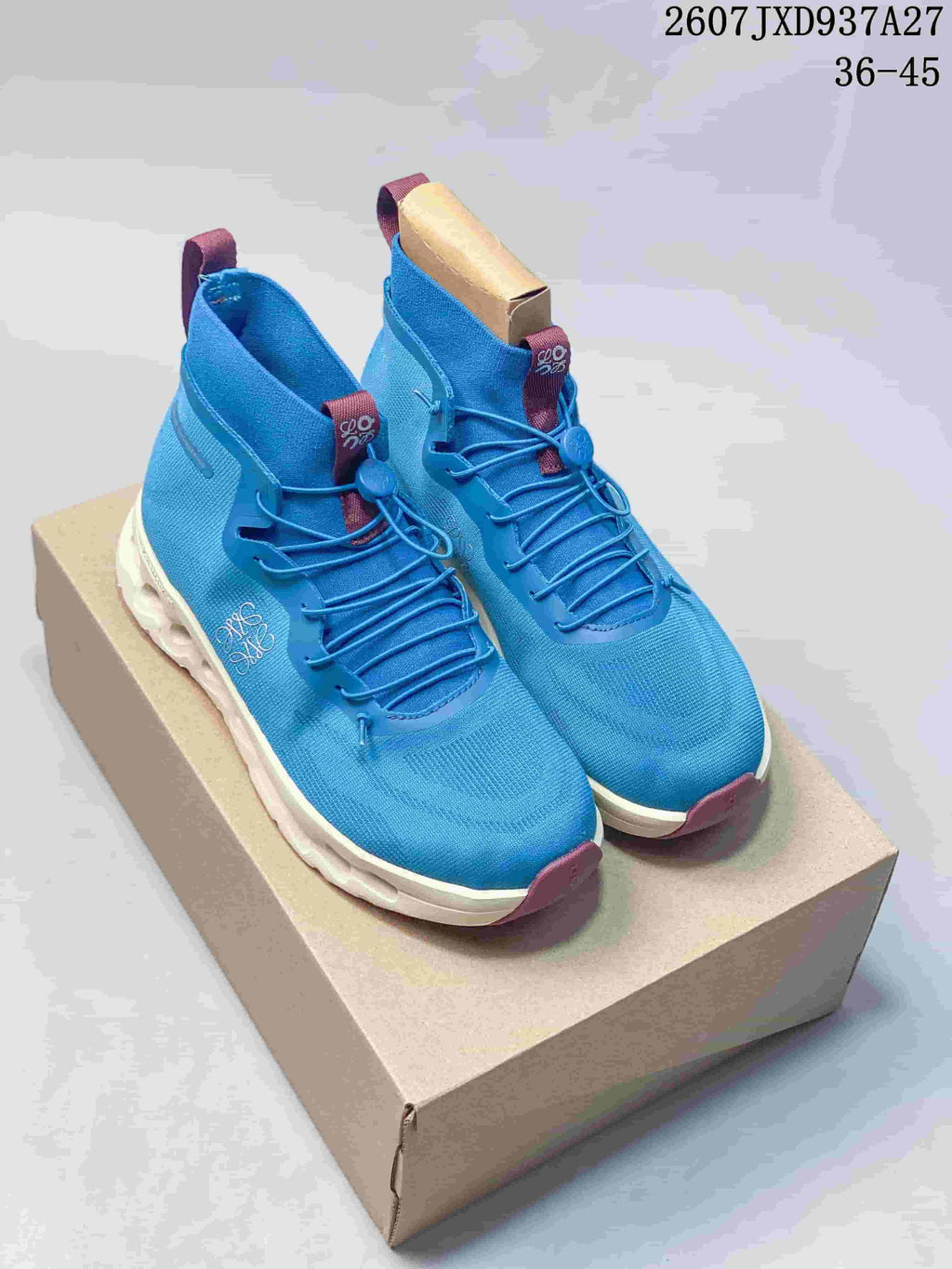 Pair of blue high-top Cloudtilt sneakers displayed on a box, with burgundy accents and white soles.