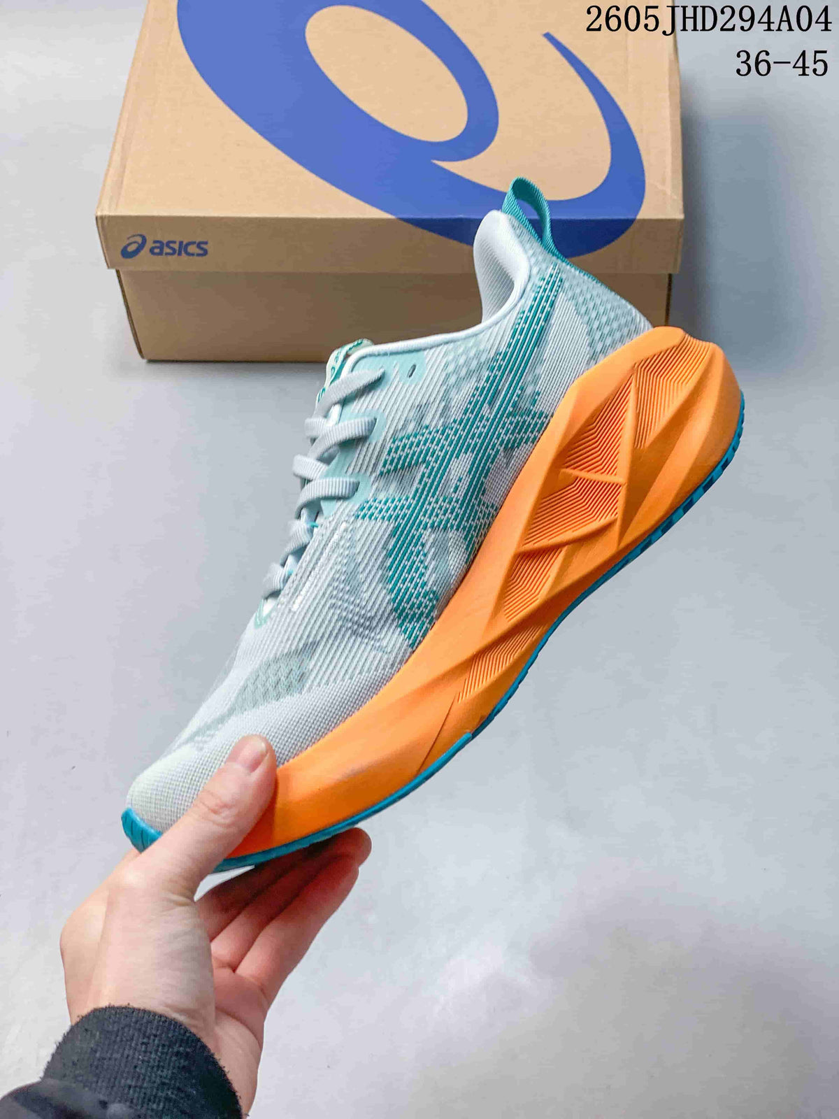 Side view of the patterned low-top running shoe with orange midsole and teal outsole
