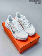 Pair of white Nike Air Zoom Pegasus 42 running shoes with silver-toned accents, displayed on an orange shoe box
