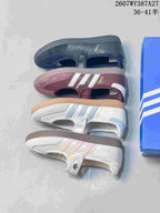 Four Samba Jane color options arranged together: black, burgundy, white with light blue, and white with pale pink detailing.